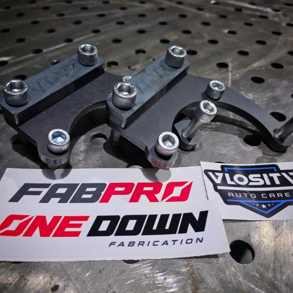 Machined caliper mount brackets and bolts from the VT–VZ Commodore hydraulic handbrake kit