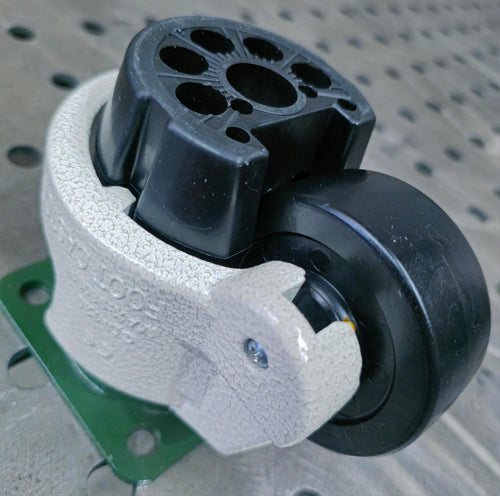 Levelling castor wheel with mounting plate on a welding table