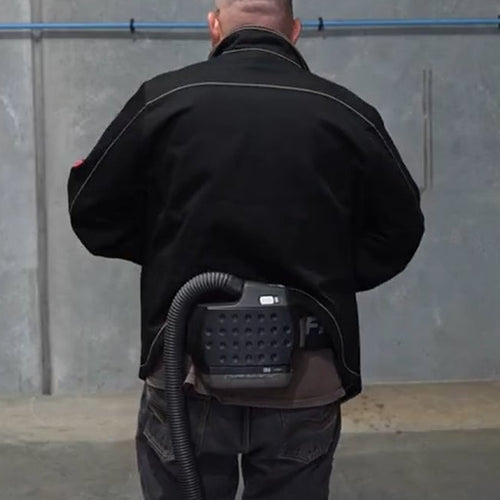 Back view of the Fabpro Welding Jacket worn over a PAPR unit